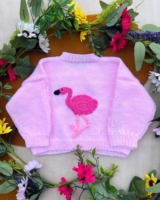 Little Flower Knits sustainable baby gift flamingo cardigan in pink with long sleeves and flamingo applique