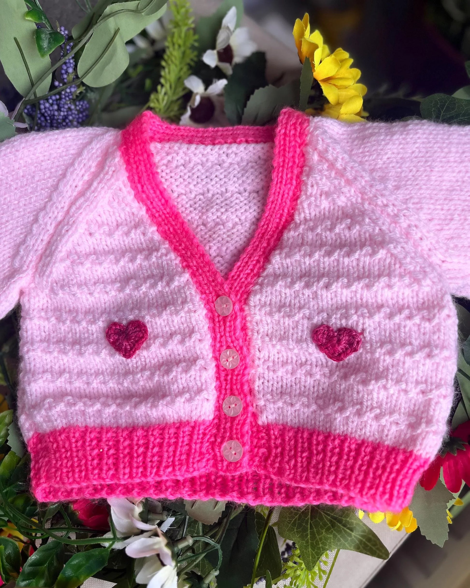 Little Flower Knits unique baby fish cardigan in pink with heart buttons and textured knit design