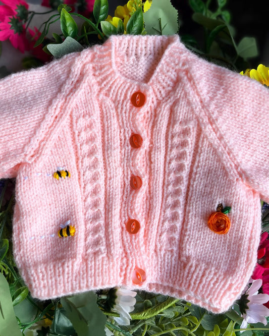 Little Flower Knits pink knitted baby cardigan with orange buttons and embroidered bees unique baby shower gift knitted