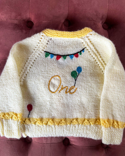 Little Flower Knits white and yellow knitted cardigan with balloons and One text perfect unique first birthday cardigan gift