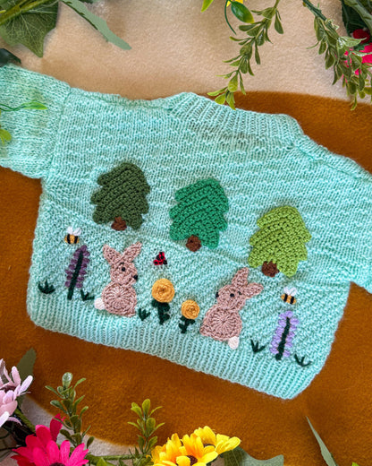 Wildflower meadow baby cardigan in mint green with embroidered trees and rabbits design