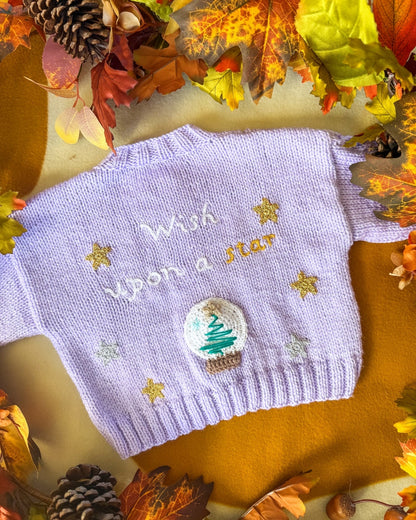 Little Flower Knits wish upon a star baby cardigan in lavender with embroidered stars and a tree design
